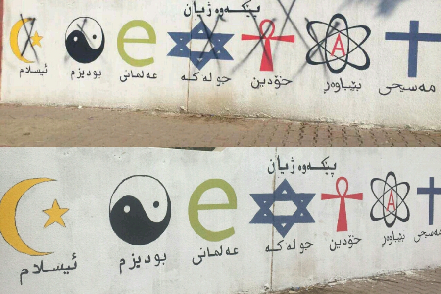 Uno dei tanti murales vandalizzati in Kurdistan